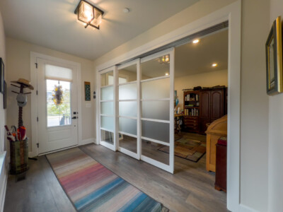 8' Sliding Glass Doors between art room and foyer with frosted glass